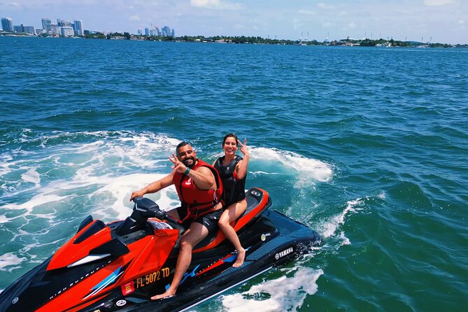 Aquatic Adventure: Boat Tour with Jetskis, Tubing, and Open Bar - Jet ski time: the adrenaline option with real rules