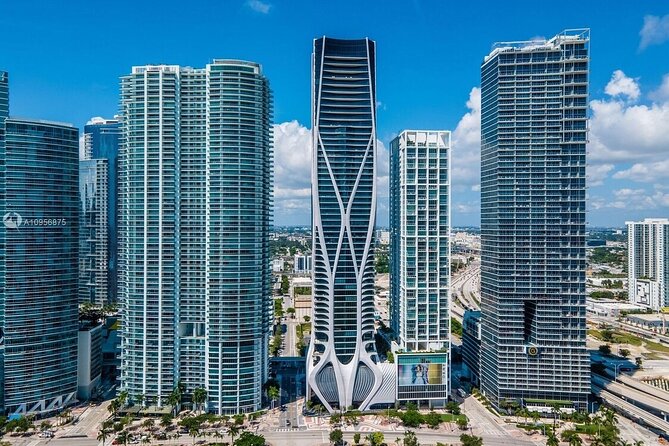 Miami City and Boat Tour Little Havana Included Plus FREE Bike Rental in SoBe - Downtown skyline from the water: Biscayne Bay man-made islands cruise